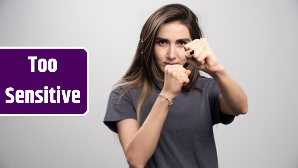 Young woman standing and posing with fists