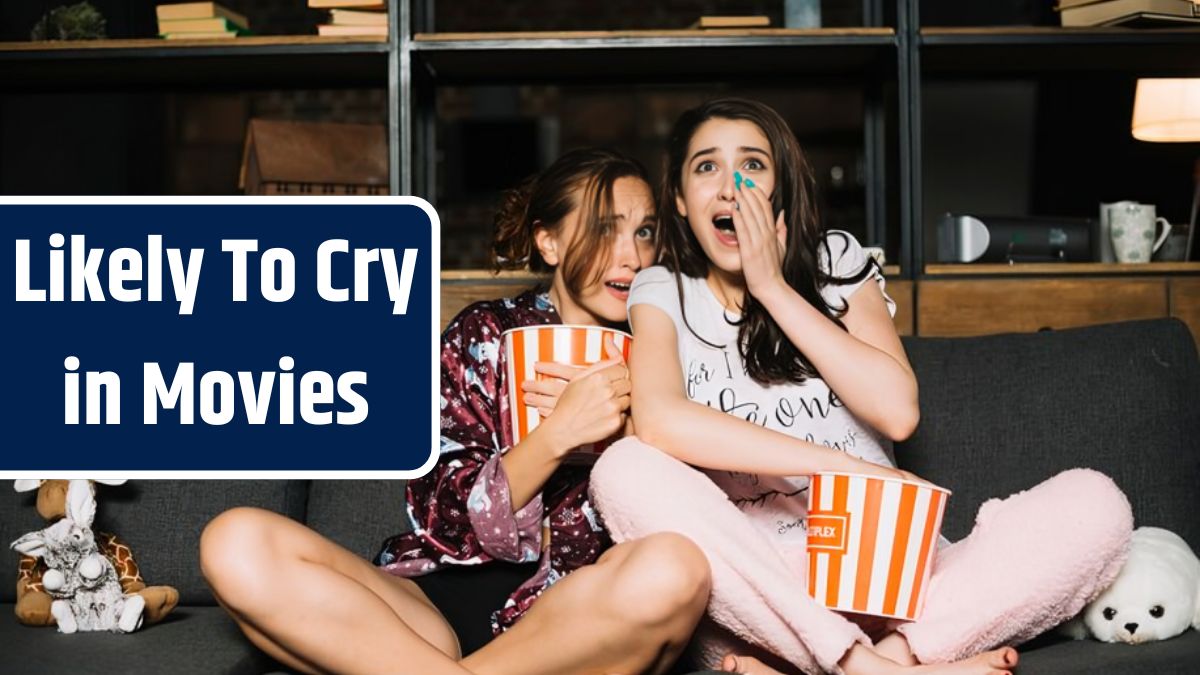 Portrait of two frightened female friends watching television