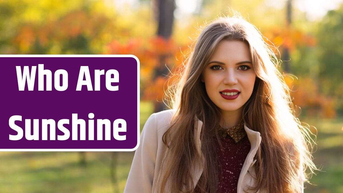 Portrait of smiling woman in autumn park