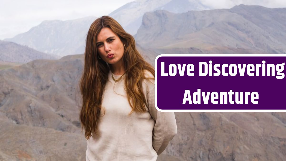 Young woman posing in front of mountain landscape