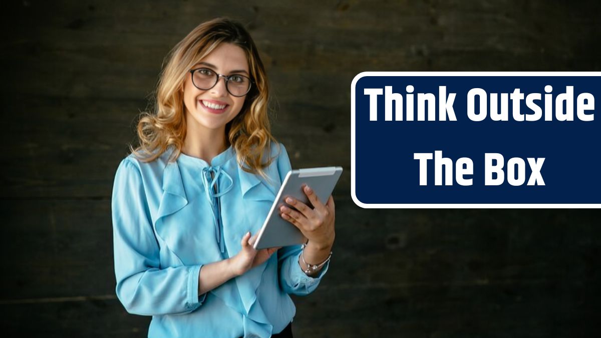 Happy beautiful young business woman standing with tablet, widely smiling.