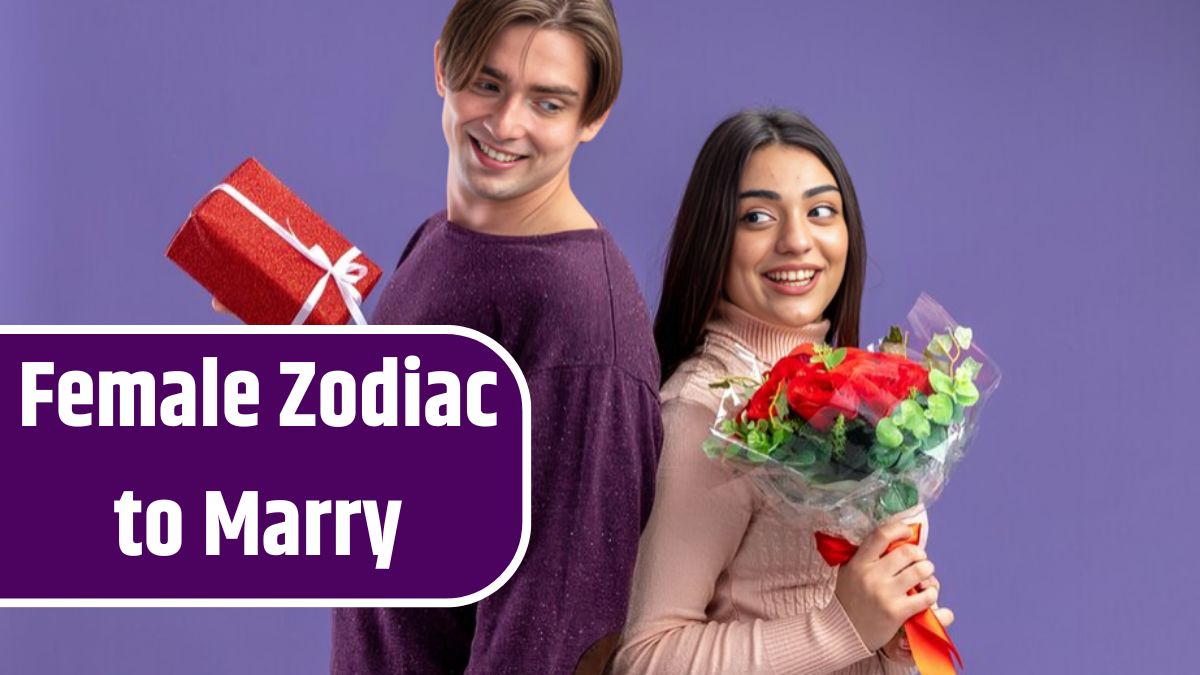 Smiling young couple on valentines day holding back to back with gift box and bouquet isolated on blue background