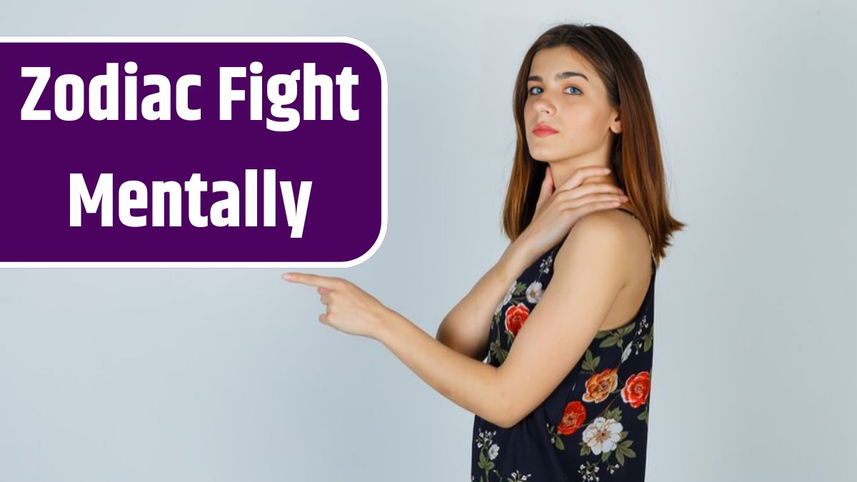 Young woman in blouse holding hand on neck, pointing straight ahead and looking confident .