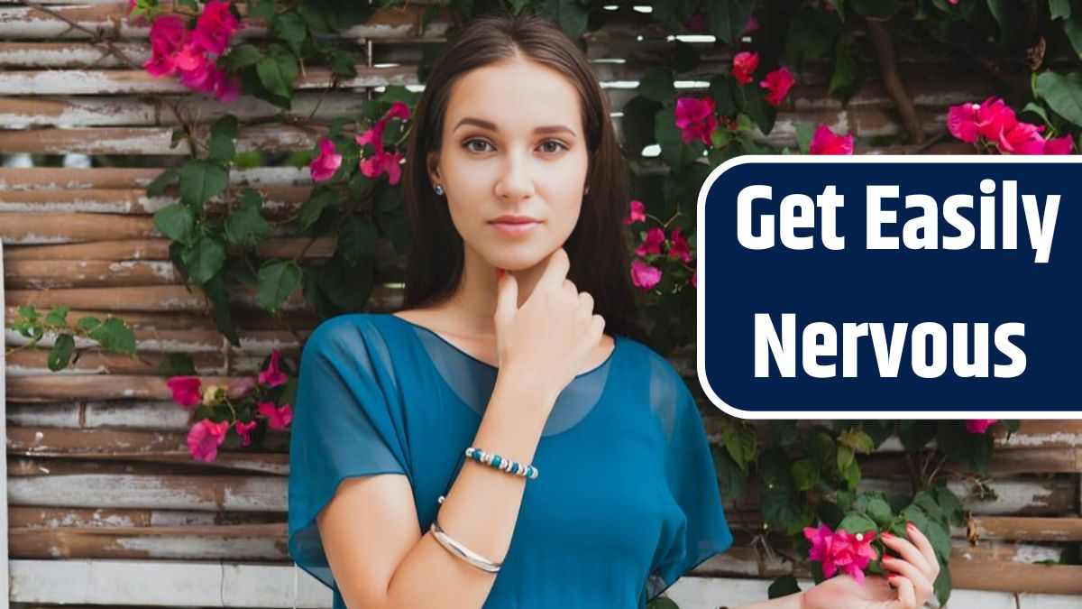 Young stylish beautiful woman in blue dress, summer fashion trend, vacation, garden, tropical hotel terrace, smiling