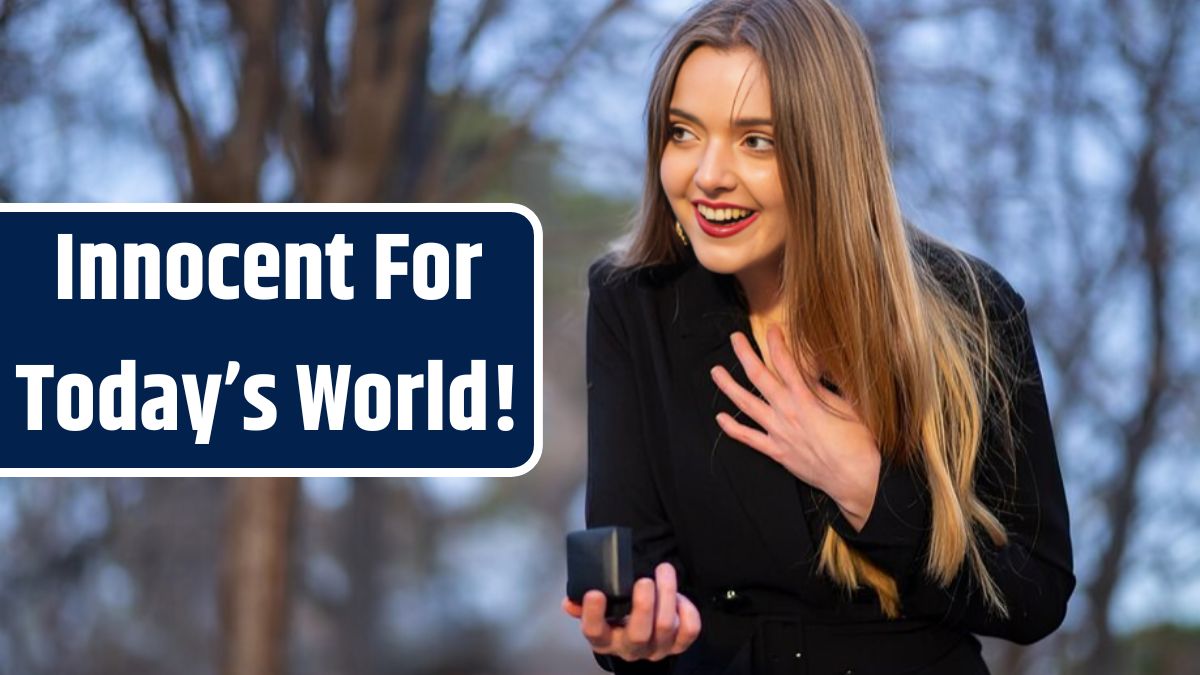 Young woman using phone while standing on tree