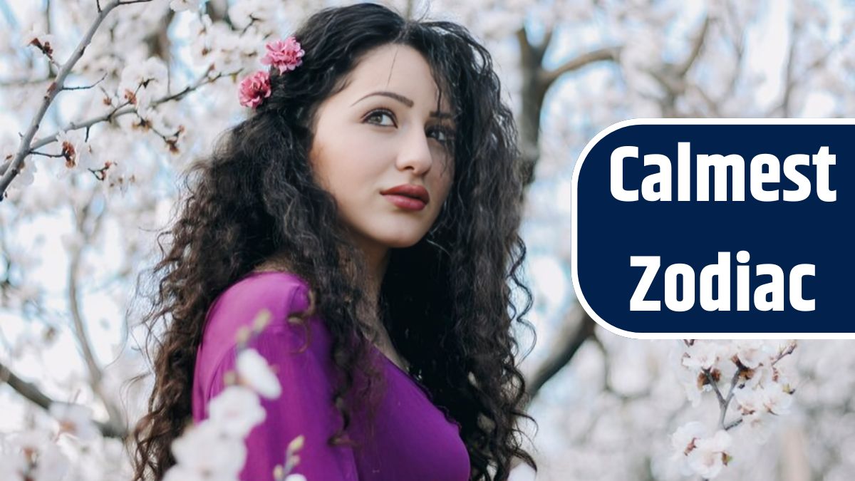 Woman with pink dress enjoying the apricot blossom in spring and wearing artificial flower in her hair