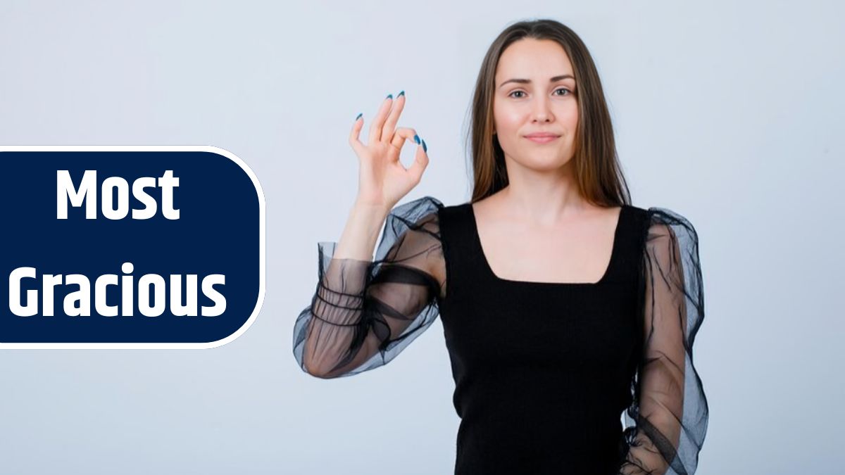 Young girl is showing okay gesture by looking at camera on white background