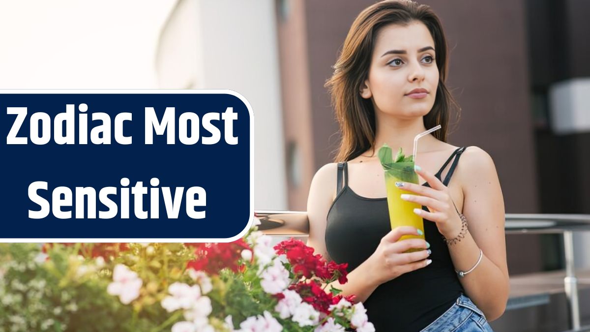 Pretty girl with yellow cocktail relaxing on the balcony with beautiful view