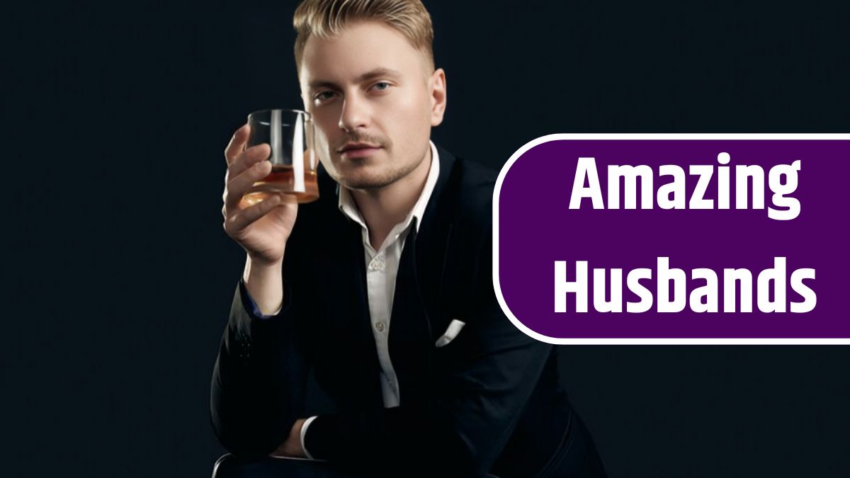 Portrait of handsome blond man in elegant tuxedo and bow tie posing with glass of whiskey on black wall