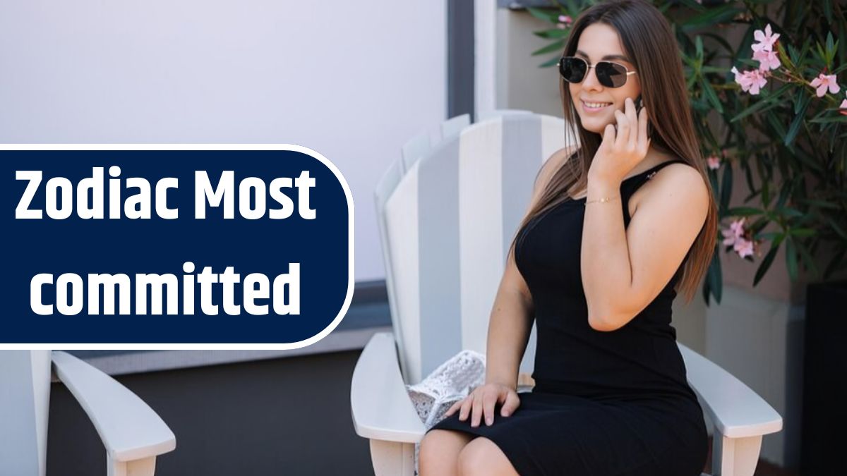 Happy smiled woman speak by phone during sitting on chair outdoor place for text